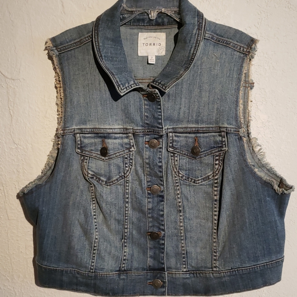 Sleeveless blue jean jacket